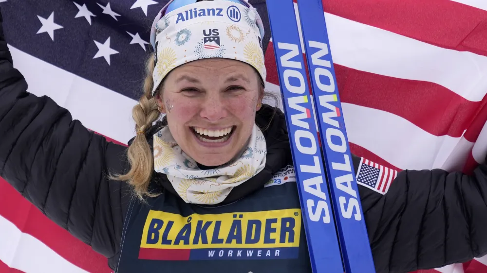 Jessie Diggins, of the United States, celebrates after winning the Women's Cross Country Interval Start 10 KM Free event at the Nordic World Championships in Planica, Slovenia, Tuesday, Feb. 28, 2023. (AP Photo/Matthias Schrader)