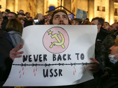 Participants protest against a draft law on "foreign agents", which critics say represents an authoritarian shift and could hurt Georgia's bid to join the European Union, during a rally outside the parliament building in Tbilisi, Georgia, March 8, 2023. REUTERS/Irakli Gedenidze