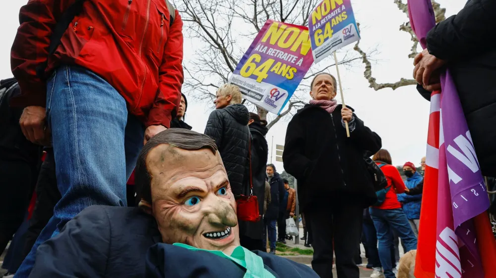 A puppet figure depicting French President Emmanuel Macron is seen as protesters attend a demonstration to protest the use of the article 49.3, a special clause in the French Constitution, to push the pensions reform bill through the National Assembly without a vote by lawmakers, by French government, in Nice, France, March 19, 2023. REUTERS/Eric Gaillard