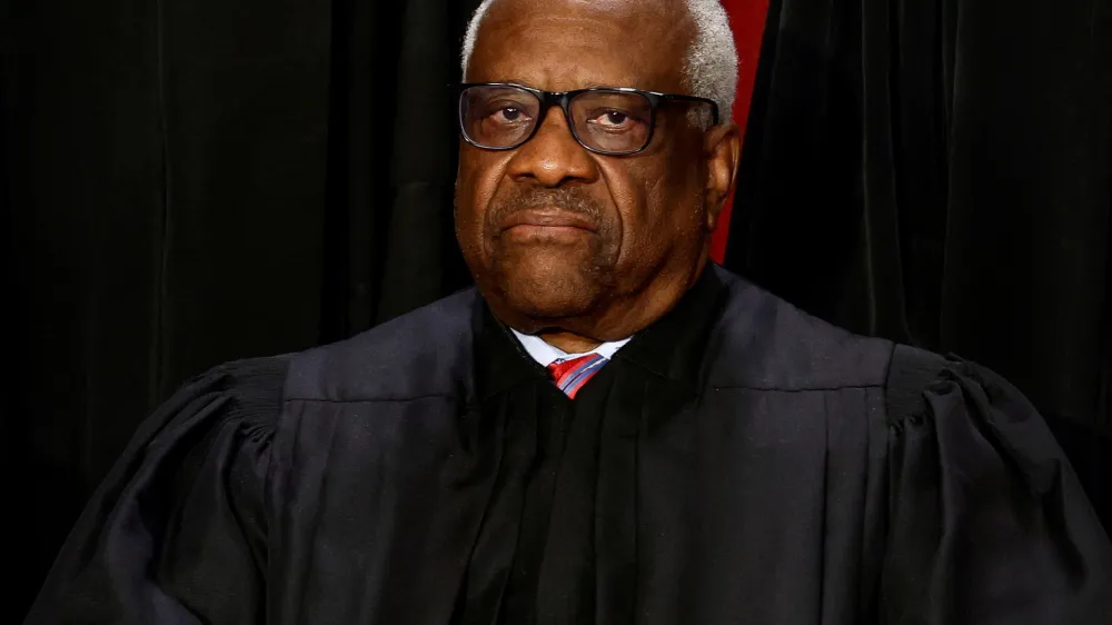 FILE PHOTO: U.S. Supreme Court Associate Justice Clarence Thomas poses during a group portrait at the Supreme Court in Washington, U.S., October 7, 2022. REUTERS/Evelyn Hockstein/File Photo