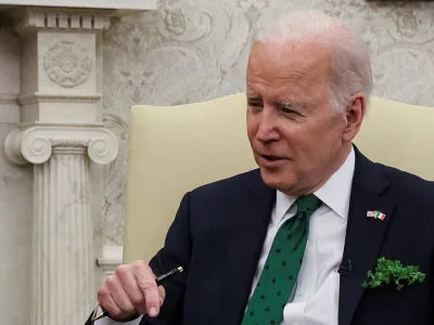 FILE PHOTO: U.S. President Joe Biden speaks while hosting a virtual St. Patrick's Day meeting with Ireland's Prime Minister Micheal Martin after Irish Taoiseach Martin tested positive for coronavirus disease (COVID-19) after arriving in Washington, in the Oval Office at the White House in Washington, U.S., March 17, 2022. REUTERS/Leah Millis/File Photo