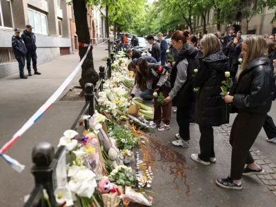 People lay tributes following a school mass shooting, after a boy opened fire on others, killing fellow students and staff in Belgrade, Serbia, May 4, 2023. REUTERS/Antonio Bronic