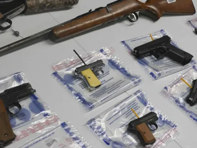 FILE - A collection of illegal guns is displayed during a gun buyback event, Saturday May 22, 2021 in the Brooklyn borough of New York. Individuals received pre-paid card payments of  up to 0 for firearms - with a bonus iPad for certain handguns or assault rifles, at the no-questions-asked event, co-sponsored by state and county attorney generals and the NYPD. According to a study published by JAMA Network Open on Tuesday, Nov. 29, 2022, the U.S. gun death rate in 2021 hit its highest mark in nearly three decades, and the rate among women has been growing faster than that of men. (AP Photo/Bebeto Matthews, File)