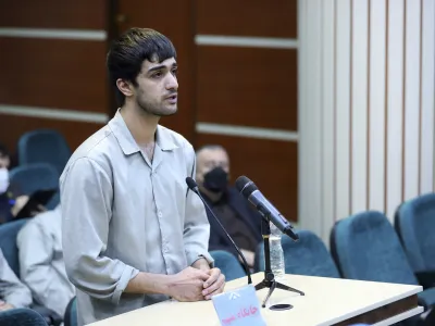 In this photo released by Mizan News Agency, Mohammad Mehdi Karami, a protester convicted and executed, speaks during his trial at the Revolutionary Court, in the city of Karaj, Iran, on Nov. 30, 2022. Iran said it executed Karami and Mohammad Hosseini on Saturday, Jan. 7, 2023, convicted of allegedly killing a paramilitary volunteer during a demonstration, the latest executions aimed at halting the nationwide protests now challenging the country's theocracy. (Amir Abbas Ghasemi/Mizan News Agency via AP)