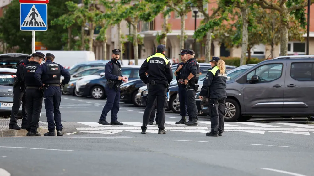 Police cordon off the area where a man and a woman died in a suspected bomb blast related to gender violence, according to the Basque regional security department, in Orio, northern Spain, May 16, 2023. REUTERS/Vincent West