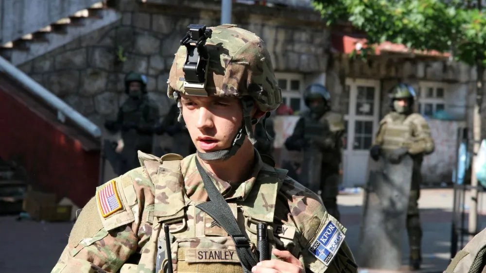 A Polish Kosovo Force (KFOR) soldier stands guard at a municipal office in Zvecan, Kosovo May 30, 2023. REUTERS/Miodrag Draskic