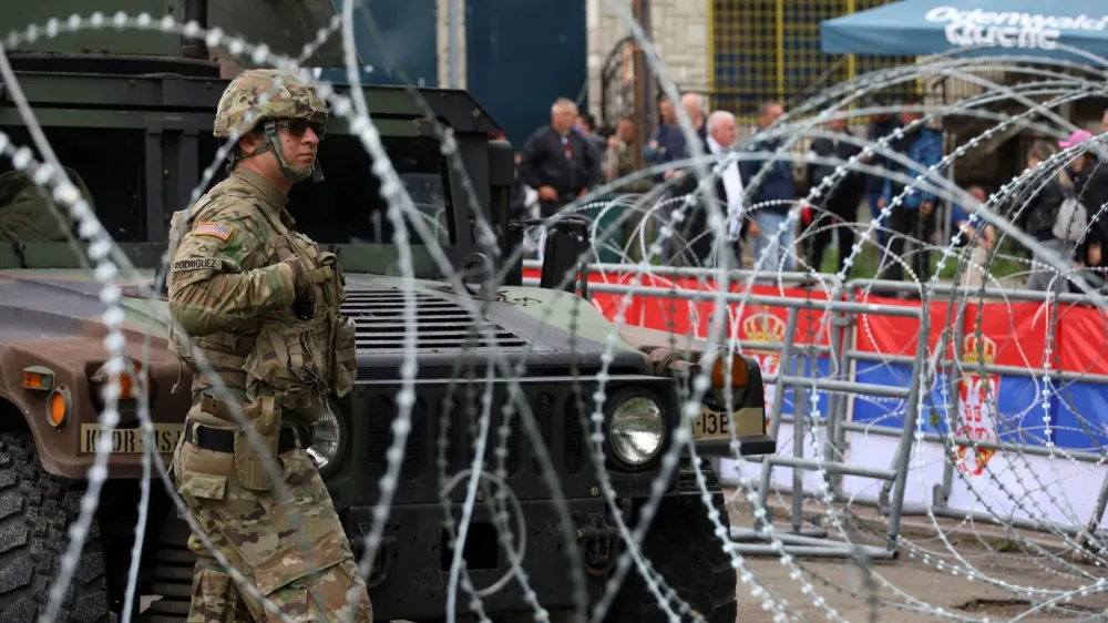 A U.S. Kosovo Force (KFOR) soldier, under NATO, stands guard near a municipal office in Leposavic, Kosovo May 31, 2023. REUTERS/Fatos Bytyci