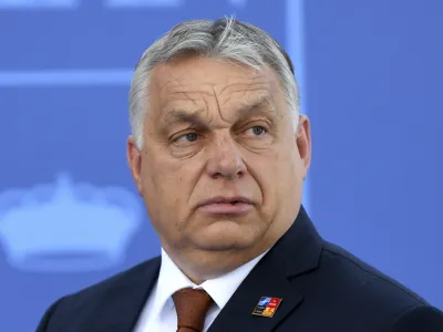 FILE - Hungary President Viktor Orban arrives at the NATO Heads of State summit in Madrid, June 30, 2022. Italy's European Union partners are signaling discomfort and vigilance after one of the bloc's founding members swung far to the political right, raising troubling questions about whether Rome will maintain its commitments to EU principles, laws and ambitions. The French prime minister on Monday, Sept. 26, 2022 said that France, along with EU officials, would be watching closely to ensure that basic human rights rights along with access to abortion, are guaranteed in Italy after Giorgia Meloni's neo-fascist Brother's of Italy Party topped the vote count in Sunday's parliamentary election. (Bertrand Guay, Pool via AP, File)