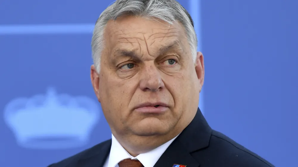 FILE - Hungary President Viktor Orban arrives at the NATO Heads of State summit in Madrid, June 30, 2022. Italy's European Union partners are signaling discomfort and vigilance after one of the bloc's founding members swung far to the political right, raising troubling questions about whether Rome will maintain its commitments to EU principles, laws and ambitions. The French prime minister on Monday, Sept. 26, 2022 said that France, along with EU officials, would be watching closely to ensure that basic human rights rights along with access to abortion, are guaranteed in Italy after Giorgia Meloni's neo-fascist Brother's of Italy Party topped the vote count in Sunday's parliamentary election. (Bertrand Guay, Pool via AP, File)