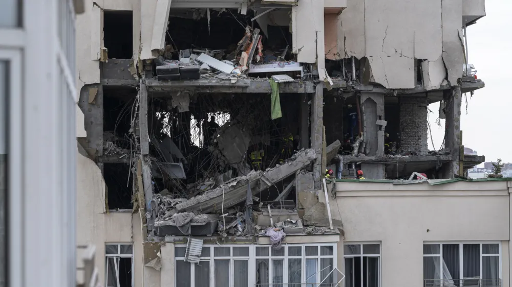 A view of an apartment building damaged following a Russian attack in Kyiv, Ukraine, Saturday, June 24, 2023. (AP Photo/Andrew Kravchenko)