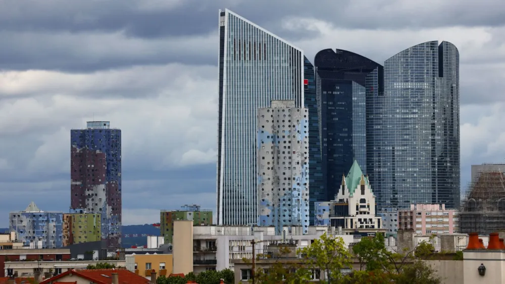 A general view shows the Tours Aillaud, the towers of the Pablo Picasso district, in Nanterre, a suburban town where riots began after the death of Nahel, a 17-year-old teenager killed by a French police officer in Nanterre during a traffic stop, Paris suburb, France, July 1, 2023. In the background, skyscraper office properties of La Defense business and financial district. REUTERS/Yves Herman