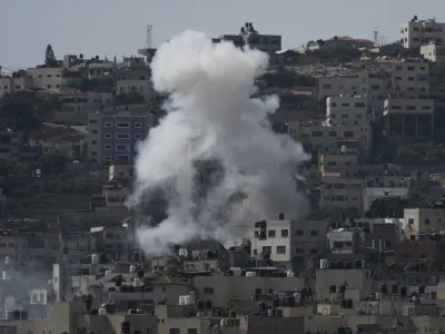 Smoke rises during an Israeli military raid of the militant stronghold of Jenin in the occupied West Bank, Monday, July 3, 2023. Palestinian health officials say at least three Palestinians were killed in the raid. (AP Photo/Majdi Mohammed)