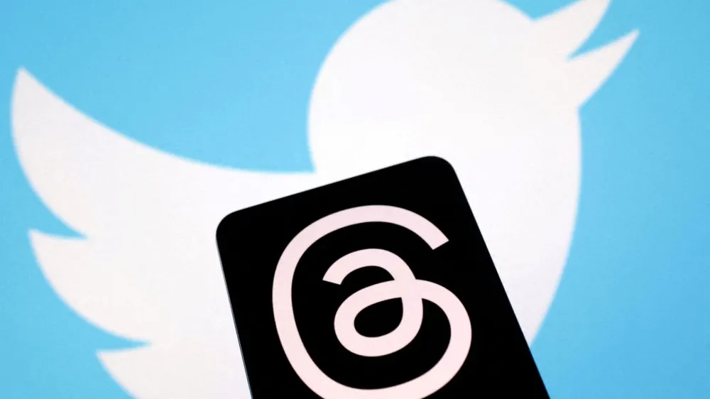 FILE PHOTO: Meta's Threads app and Twitter logos are seen in this illustration taken July 4, 2023. REUTERS/Dado Ruvic/Illustration/File Photo