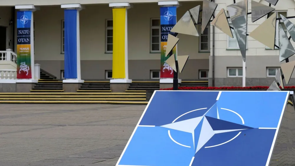 A NATO sign is seen next to the Presidential Palace in Vilnius, Lithuania July 10, 2023. REUTERS/Ints Kalnins