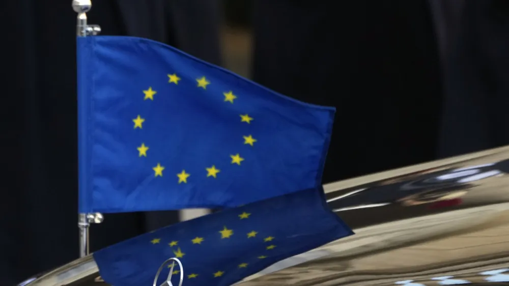 FILE - The European flag is seen on the car of European Council President Charles Michel on his arrival for a meeting with French President Emmanuel Macron at the Elysee Palace, in Paris, France, Tuesday, Jan. 11, 2022. The European Union has moved closer to a clinching a deal over transatlantic data transfers aimed at resolving concerns about U.S. spying with a draft decision that confirms "comparable safeguards" to those in the EU, which has stringent privacy rules. (AP Photo/Francois Mori, FILE)