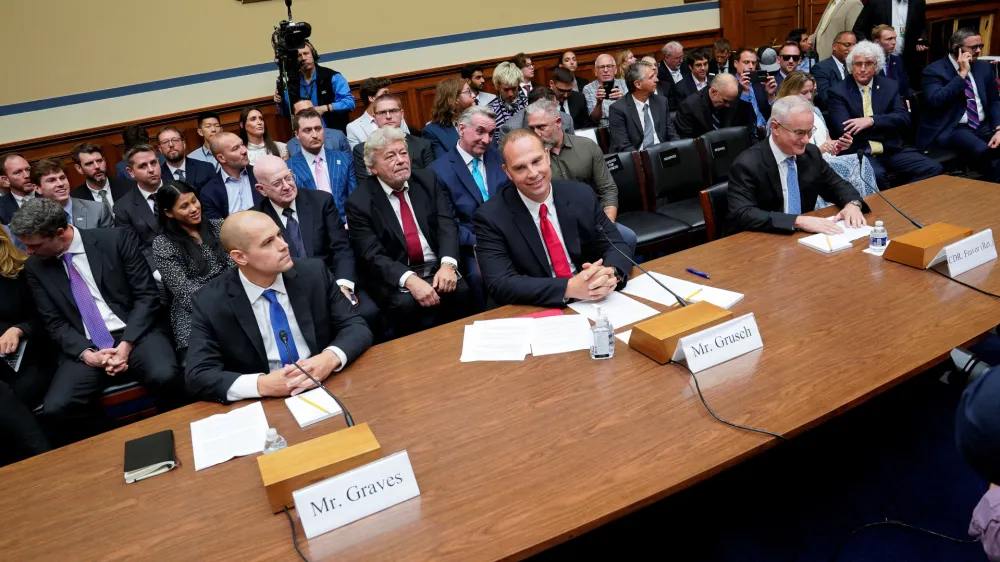 Ryan Graves, executive director of Americans for Safe Aerospace, David Grusch, former National Reconnaissance Office representative on the Defense Department's Unidentified Aerial Phenomena Task Force, and retired Navy Commander David Fravor attend House Oversight & Accountability Committee's National Security, the Border, and Foreign Affairs Subcommittee's hearing on "Unidentified Anomalous Phenomena: Implications on National Security, Public Safety, and Government Transparency" at the U.S. Capitol Hill in Washington, U.S., July 26, 2023. REUTERS/Elizabeth Frantz