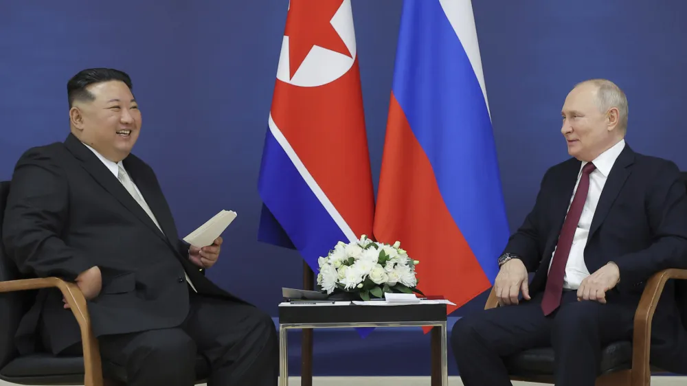 In this photo provided by the North Korean government, North Korean leader Kim Jong Un, left, and Russian President Vladimir Putin talk at the Vostochny cosmodrome outside the city of Tsiolkovsky, about 200 kilometers (125 miles) from the city of Blagoveshchensk in the far eastern Amur region, Russia, Wednesday, Sept. 13, 2023. Independent journalists were not given access to cover the event depicted in this image distributed by the North Korean government. The content of this image is as provided and cannot be independently verified. Korean language watermark on image as provided by source reads: "KCNA" which is the abbreviation for Korean Central News Agency. (Korean Central News Agency/Korea News Service via AP)