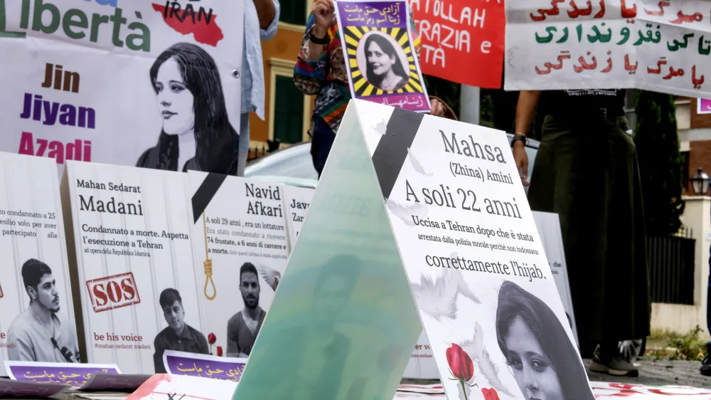 People attend a protest rally in Rome, Italy, Saturday, Sept. 16, 2023 to mark the first anniversary of the death of Mahsa Amini in the custody of Iran's morality police. (Mauro Scrobogna/LaPresse via AP)