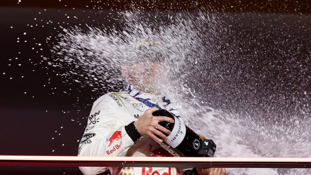 Formula One F1 - Las Vegas Grand Prix - Las Vegas Strip Circuit, Las Vegas, Nevada, U.S - November 18, 2023 First place Red Bull's Max Verstappen celebrates on the podium REUTERS/Mike Blake