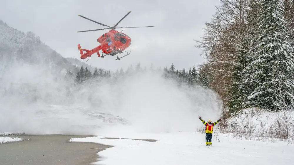 25 November 2023, Austria, Grünau Im Almtal: A helicopter lands near the accident site where a small plane crashed. All four occupants of a small aircraft have died in a crash in the mountains of northern Austria, authorities said. Photo: Team Fotokerschi.At / David Raus/APA/dpa