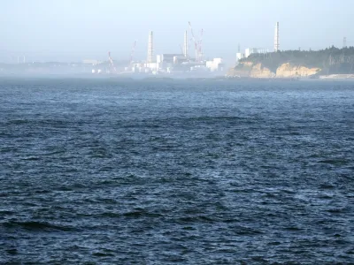 FILE - The Fukushima Daiichi nuclear power plant, damaged by a massive March 11, 2011, earthquake and tsunami, is seen from the nearby Ukedo fishing port in Namie town, northeastern Japan, on Aug. 24, 2023. The release of a third batch of treated radioactive wastewater from Japan's damaged Fukushima nuclear plant into the Pacific Ocean ended safely as planned, its operator said Monday, Nov. 20, as the country's seafood producers continue to suffer from a Chinese import ban imposed after the discharges began. (AP Photo/Eugene Hoshiko, File)