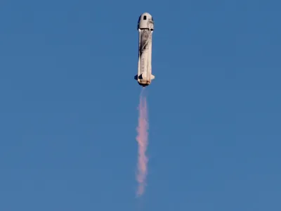 FILE PHOTO: A Blue Origin New Shepard rocket lifts off with a crew of six from Launch Site One in west Texas, U.S. December 11, 2021. REUTERS/Joe Skipper/File Photo