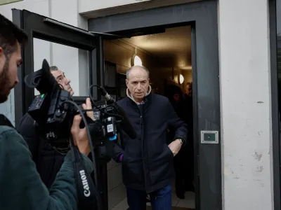 Meaux's mayor Jean-Francois Cope answers journalists questions following the murder of a woman and her four children in a knife attack early on Christmas Day in Meaux, northeast of Paris, France, December 26, 2023. REUTERS/Benoit Tessier