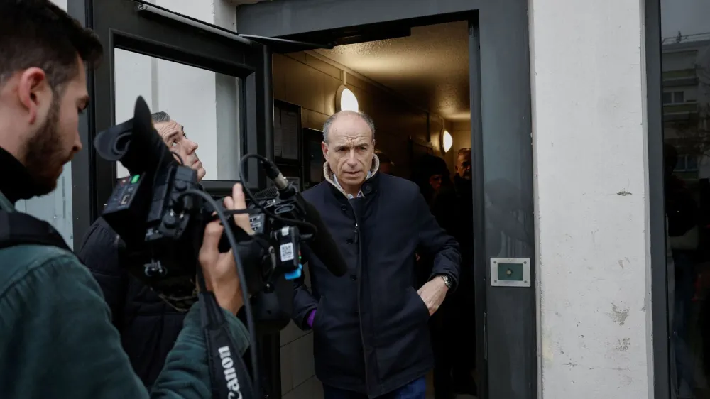 Meaux's mayor Jean-Francois Cope answers journalists questions following the murder of a woman and her four children in a knife attack early on Christmas Day in Meaux, northeast of Paris, France, December 26, 2023. REUTERS/Benoit Tessier