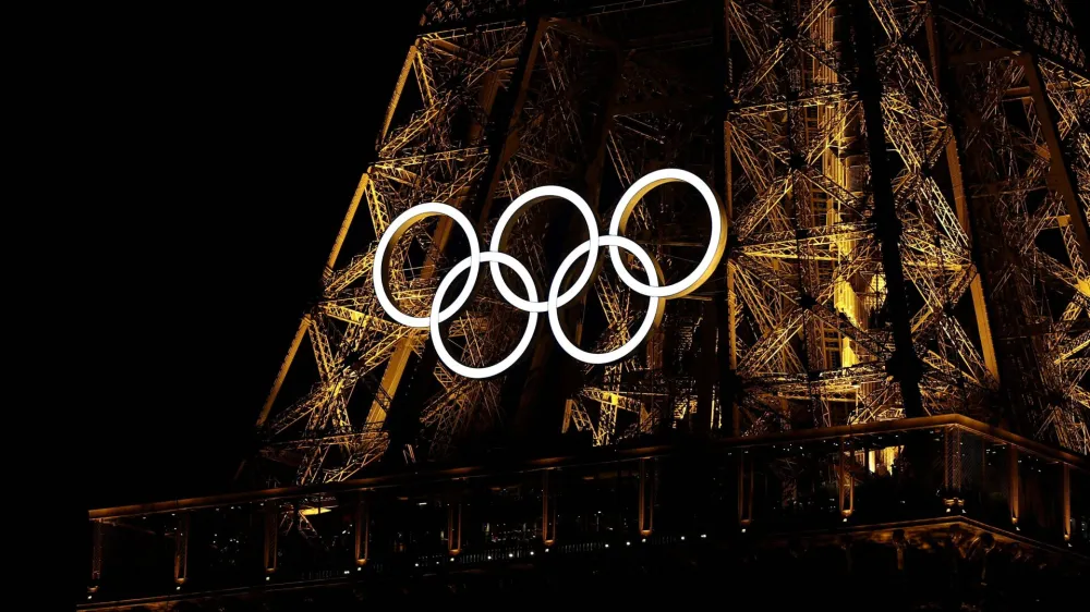 A general view of the Olympic rings on the Eiffel Tower a day before the opening ceremony of the Paris 2024 Olympics, in Paris, France July 25, 2024. REUTERS/Agustin Marcarian   TPX IMAGES OF THE DAY   REFILE - CORRECTING MONTH FROM "JUNE" TO "JULY".