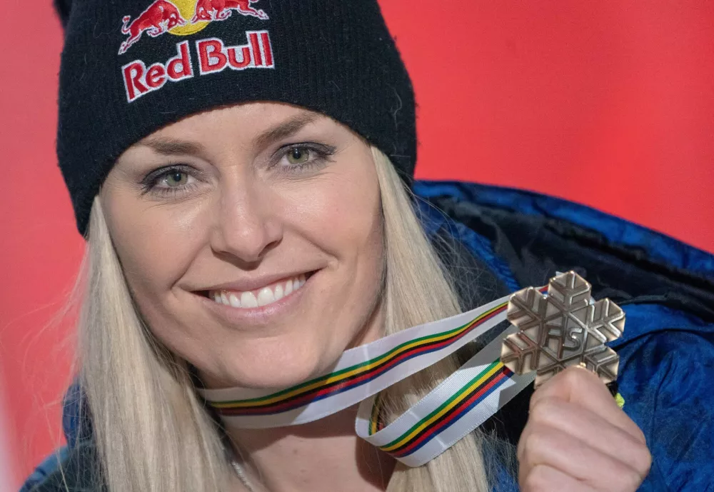 FILED - 10 February 2019, Sweden, Are: USA's Lindsey Vonn celebrates on the award ceremony with a bronze medal of the women's downhill race during the FIS Alpine World Ski Championships. Four-time alpine skiing World Cup champion Lindsey Vonn is considering a comeback in Beaver Creek in December, the Blick newspaper reported. Photo: Michael Kappeler/dpa