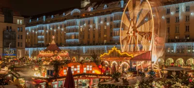 Dresden, Germany - December 20, 2010: An unidentified group of people enjoy Christmas market in Dresden on December 20, 2010 in Dresden, Germany. It is Germany's oldest Christmas Market with a very long history dating back to 1434.