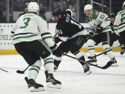 Dec 4, 2024; Los Angeles, California, USA; Los Angeles Kings center Anze Kopitar (11) skates against the Dallas Stars during the second period of a hockey game at Crypto.com Arena. Mandatory Credit: Jessica Alcheh-Imagn Images