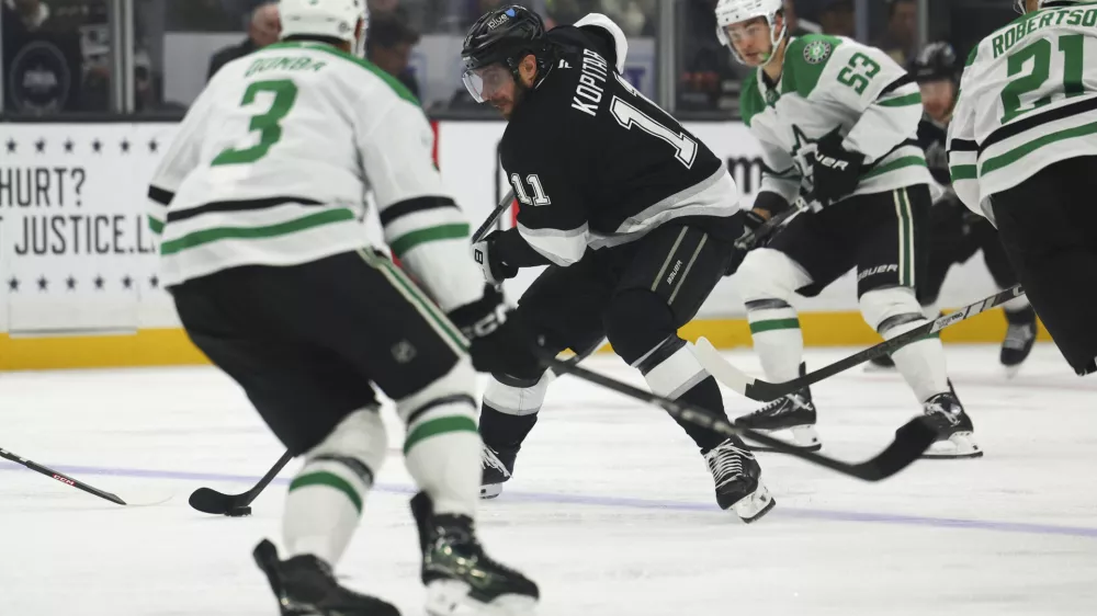 Dec 4, 2024; Los Angeles, California, USA; Los Angeles Kings center Anze Kopitar (11) skates against the Dallas Stars during the second period of a hockey game at Crypto.com Arena. Mandatory Credit: Jessica Alcheh-Imagn Images