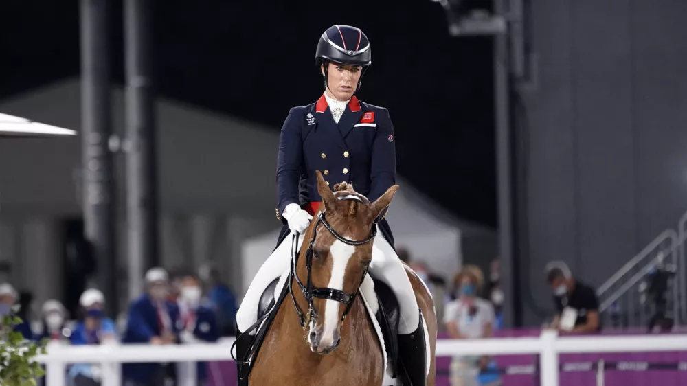 FILE - Britain's Charlotte Dujardin, riding Gio, competes in the equestrian dressage individual final at the 2020 Summer Olympics, Wednesday, July 28, 2021, in Tokyo. (AP Photo/David Goldman, File)