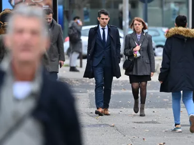 Frenchwoman Gisele Pelicot, the victim of an alleged mass rape orchestrated by her husband Dominique Pelicot at their home in the southern French town of Mazan, arrives with her lawyers Stephane Babonneau and Antoine Camus in court as prosecutors say what sentences they are seeking in the trial for Dominique Pelicot and 50 co-accused, at the courthouse in Avignon, France, November 25, 2024. REUTERS/Alexandre Dimou