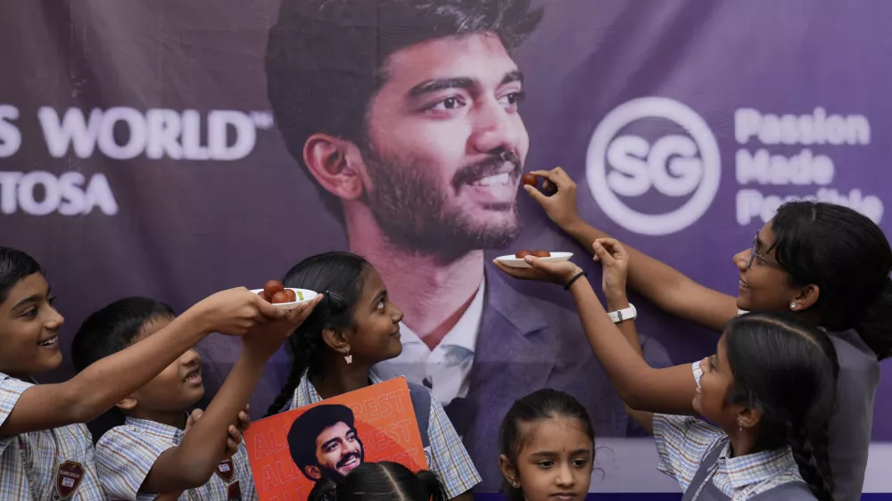 Students at Gukesh Dommaraju's school in Chennai celebrate after Gukesh became the youngest World Chess Champion, in Chennai, India, Friday, Dec. 13, 2024. (AP Photo/Mahesh Kumar A.)