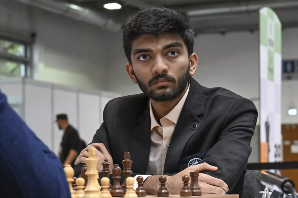 FILE - Gukesh D of India looks on as he plays against Richard Rapport of Hungary during the Hungary vs. India match in the 6th round of the 45th Chess Olympiad in Budapest, Hungary, Sept. 16, 2024. (Tibor Illyes/MTI via AP, File)