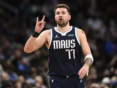 Dallas Mavericks guard Luka Doncic (77) gestures during the second half of an NBA basketball game against the Washington Wizards, Thursday, Dec. 5, 2024, in Washington. The Mavericks won 137-101. (AP Photo/Nick Wass)