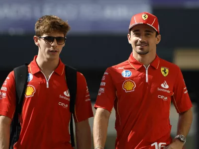 Formula One F1 - Abu Dhabi Grand Prix - Yas Marina Circuit, Abu Dhabi, United Arab Emirates - December 5, 2024 Ferrari's Charles Leclerc and Ferrari test driver Arthur Leclerc ahead of the grand prix REUTERS/Hamad I Mohammed