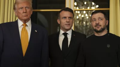 French President Emmanuel Macron, center, poses with President-elect Donald Trump, left, and Ukraine's President Volodymyr Zelenskyy at the Elysee Palace, Saturday, Dec. 7, 2024 in Paris. (AP Photo/Aurelien Morissard)