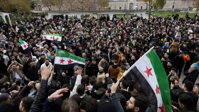 Syrians living in Turkey celebrate with opposition flags after Syrian rebels announced that they have ousted President Bashar al-Assad, in front of the Fatih Mosque in Istanbul, Turkey, December 8, 2024. REUTERS/Umit Bektas