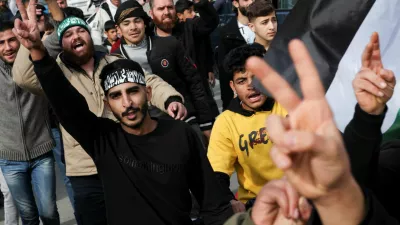 People, including Syrians, celebrate after Syrian rebels announced that they have ousted President Bashar al-Assad, at Masnaa Border Crossing, Lebanon, December 8, 2024. REUTERS/Amr Abdallah Dalsh   TPX IMAGES OF THE DAY