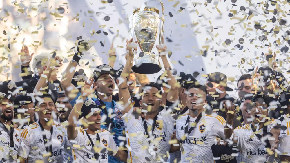 07 December 2024, US, Los Angeles: LA Galaxy's Maya Yoshida and teammates celebrate with the trophy after the Final of the Audi 2024 MLS Cup match between the LA Galaxy and the New York Red Bulls at Dignity Health Sports Park Stadium in Carson, California. Photo: Douglas Cuellar/PI via ZUMA Press Wire/dpa