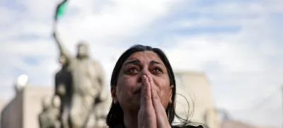 A woman reacts, as people celebrate after Syrian rebels announced that they have ousted President Bashar al-Assad, in Majdal Shams, a Druze village in the Israeli-occupied Golan Heights, December 8, 2024. REUTERS/Stoyan Nenov