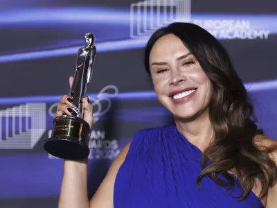 Karla Sofia Gascon, of Spain, winner of the European Actress category for "Emilia Perez", poses with her statuette during the European Film Awards gala at the Culture and Convention Center KKL in Lucerne, Switzerland, Saturday, Dec. 7, 2024.(Philipp Schmidli/Keystone via AP)