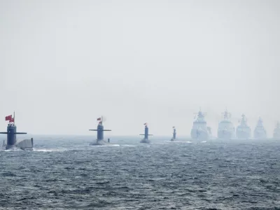 ﻿Chinese Navy submarines and warships take part in an international fleet review to celebrate the 60th anniversary of the founding of the People's Liberation Army Navy in Qingdao, Shandong province, in this April 23, 2009 file photo. To match Special Report BREAKOUT-SUBMARINES/   REUTERS/Guang Niu/Pool/Files (CHINA - Tags: MILITARY POLITICS ANNIVERSARY)