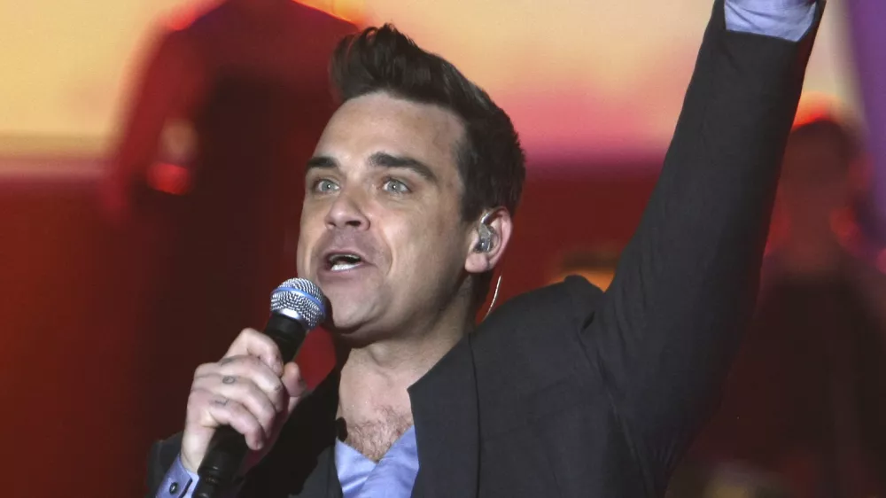 Robbie Williams bo zvezda julijskega koncerta v Trstu. / Foto: AP