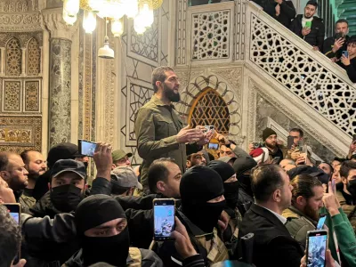 Top rebel commander Abu Mohammed al-Golani speaks to a crowd at Ummayad Mosque in Damascus, after Syrian rebels announced that they have ousted President Bashar al-Assad, Syria December 8, 2024. REUTERS/Mahmoud Hassano   TPX IMAGES OF THE DAY