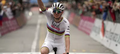 Reigning World Champion Slovenia's Tadej Pogacar celebrates winning Il Lombardia, Tour of Lombardy cycling race, in Como, Italy, Saturday, Oct. 12, 2024. (Marco Alpozzi/LaPresse via AP)