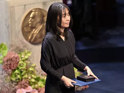 Nobel laureate in literature Han Kang holds her award during the Nobel Prize ceremony in Stockholm, Sweden, Tuesday, Dec. 10, 2024. (Jonas Ekstroemer/TT News Agency via AP)